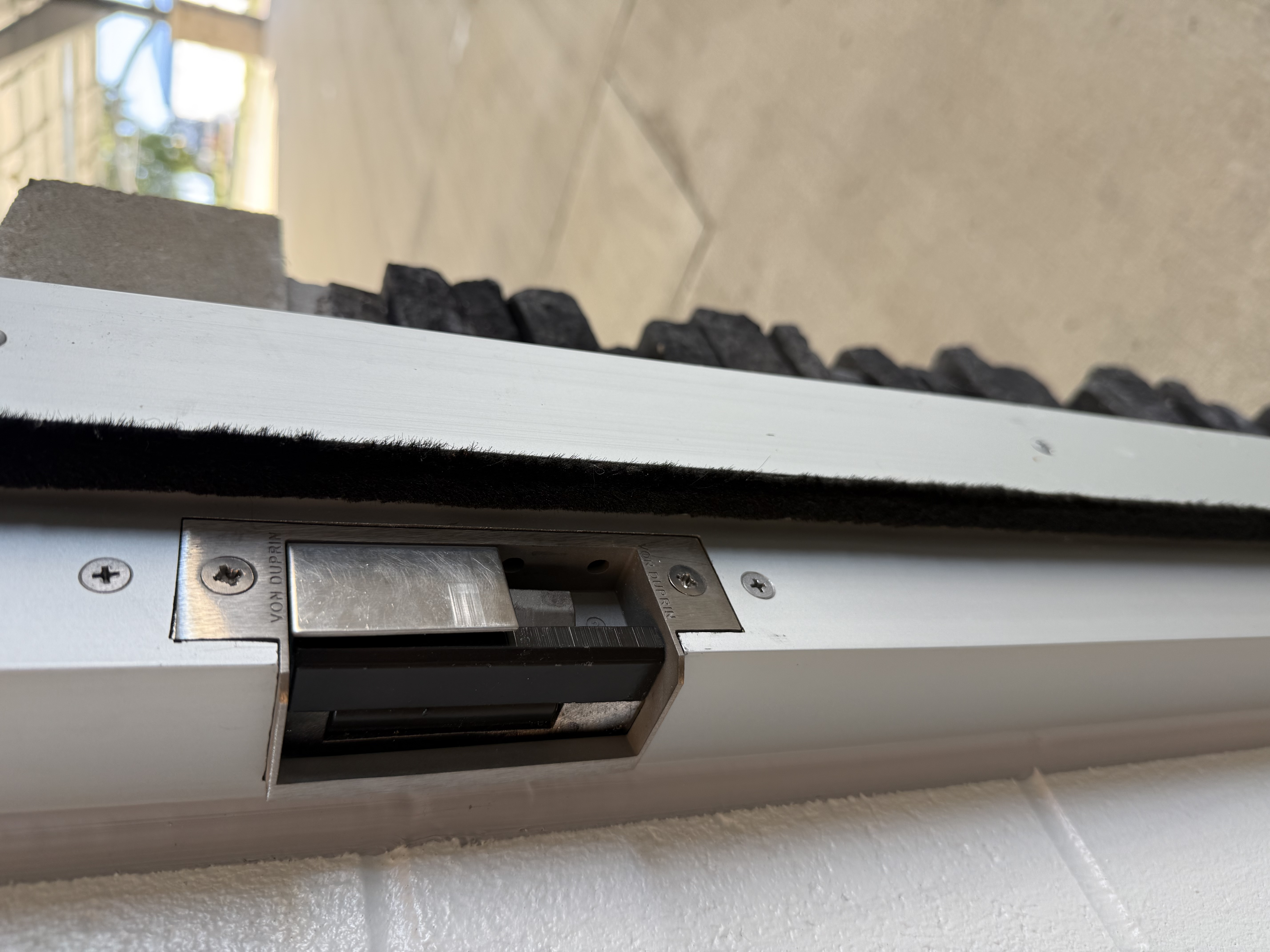 Electronic strike installed in commercial door frame